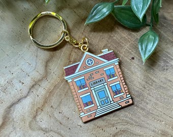 Llavero esmaltado con diseño de biblioteca/Regalo para amantes de los libros