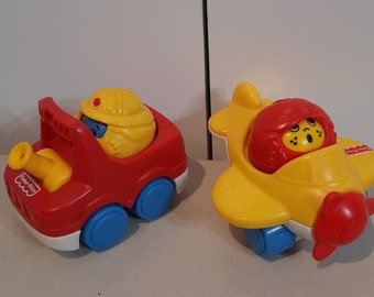 Plane, fire truck roll round Fisher Price roll round