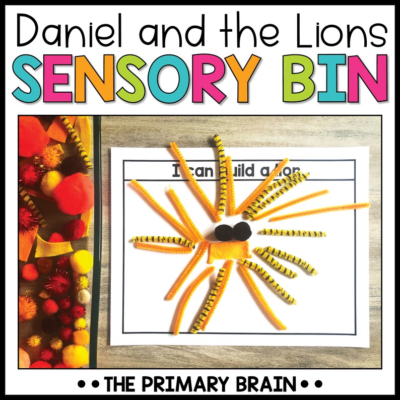 May include: A sensory bin activity for children featuring a craft project to build a lion using orange and black pipe cleaners. The text on the white card reads "I can build a lion".