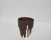 Small brown pot for succulents with white upside-down drip