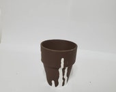 Small brown pot for succulents with white upside-down drip