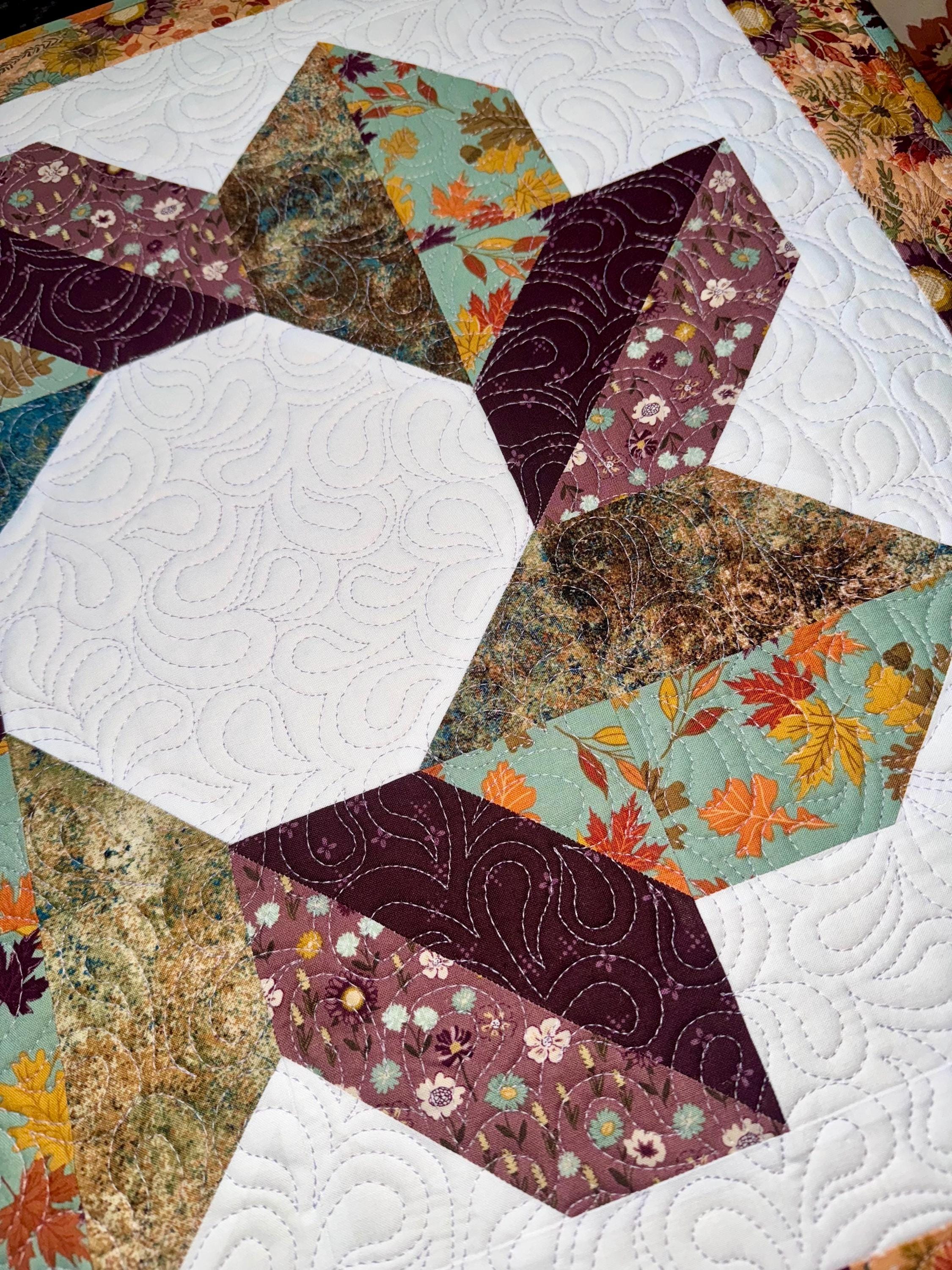Yuletide Whirl Quilted Table Topper NCU0NXD248