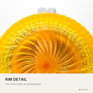 Rim detail of the yellow shaving bowl, showing the moulded pyramid texture on the outer wall and the orange fan swirl dropping away inside the well.