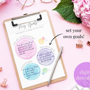 May include: A printable worksheet with a pink background and a brown clipboard. The worksheet is titled "My Goals" and includes sections for "Why am I on this journey?", "Long term goals", and "Short term goals". The worksheet is designed to help people set and achieve their goals.