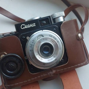 Film camera Smena LOMO with a T-22 4.5/40 triplet lens in a case of the USSR