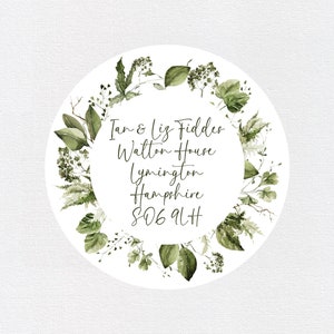 May include: A white circle with a green leafy border. The text inside the circle reads "Ian & Liz Fiddes Walton House Lymington Hampshire SO41 9LH".