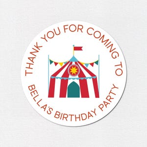 May include: A circular sticker with the text "THANK YOU FOR COMING TO BELLA'S BIRTHDAY PARTY" in red. The sticker features a cartoon circus tent in red, blue, and yellow with a starburst design, perfect for a birthday party.
