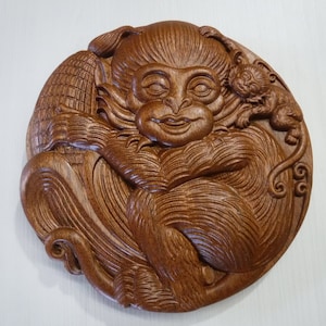 Baby monkey mahogany wood carving