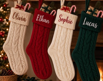 May include: Four cable-knit Christmas stockings hanging in a row, featuring the names Olivia, Ethan, Sophie, and Lucas embroidered on the cuffs. Each stocking is filled with a small wrapped gift and a candy cane, showcasing cream, red, and green colors.