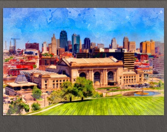 May include: A watercolour painting of the Kansas City skyline with Union Station in the foreground. The city is painted in shades of blue, green, and brown, with a bright blue sky. The station is a large, ornate building with a dome and arches.