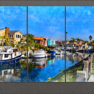 May include: A triptych canvas print depicting a coastal scene. The artwork showcases a canal with boats, houses, and palm trees under a bright blue sky. The style is reminiscent of a watercolor painting.