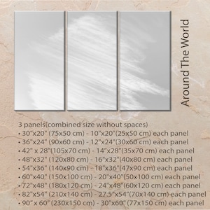 May include: Three panels of a white and gray abstract cloud design with the text "Around The World" in black. The image shows the different sizes available for the print, with measurements in inches and centimeters.