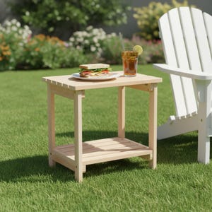 May include: A light-colored wooden side table with a slatted top and a lower shelf. On the table sits a white plate with a sandwich and a tall glass of iced tea with a lemon slice and a straw. The table has four straight legs and a simple frame.