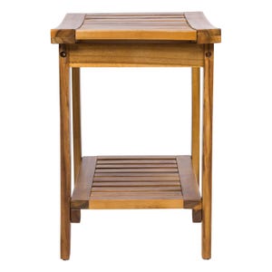 May include: A two-tiered wooden side table with a natural finish. The table has a rectangular top and a lower shelf, both with slatted surfaces. The legs are straight and sturdy, and the table is designed for indoor use. The table measures approximately 24 inches high.