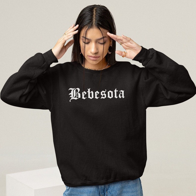 May include: Black sweatshirt with a white graphic print that says "Bebesota" in a gothic font.