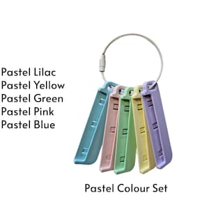 May include: A set of five rectangular plastic tools in pastel lilac, yellow, green, pink, and blue, held together by a silver metal ring. The text reads: Pastel Lilac, Pastel Yellow, Pastel Green, Pastel Pink, Pastel Blue, Pastel Colour Set.
