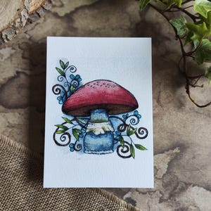 Carte Champignon Rouge et Arabesque Feuilles – Illustration Fantaisie