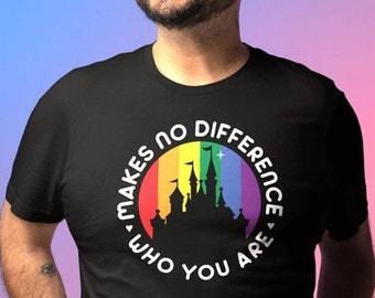 May include: Black t-shirt with a rainbow-colored graphic of a castle and the text "Who You Are Makes No Difference". The design is circular and features a vibrant spectrum of colors.