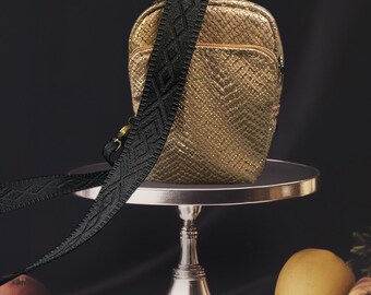 Gold vegan leather sling.