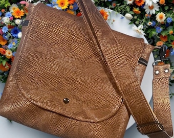Beautiful metallic copper color faux leather crossbody/handbag.