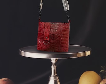 Red, Croc, front snap closure.