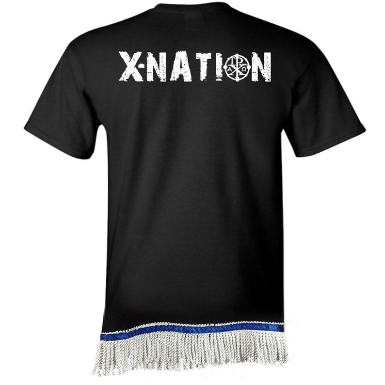 May include: Black t-shirt with white distressed text "X-NATION" and a circular emblem. The bottom hem features a blue band with white fringe.