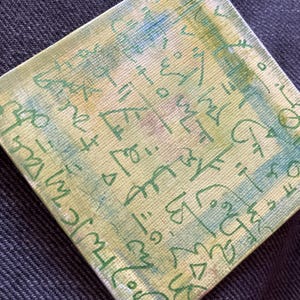 May include: A small, square canvas painting with an abstract design in shades of green, yellow and blue. The painting is covered in a variety of green lines and shapes.