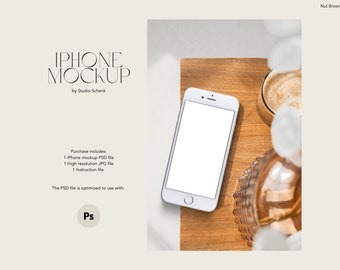 May include: A white iPhone mockup on a wooden surface with a cup of coffee and a decorative glass vase. The text "IPHONE MOCKUP by Studio Schenk" is visible at the top of the image.