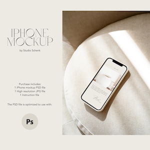 May include: An iPhone mockup with a white screen displaying a website design, resting on a beige surface. The phone has a black border. Text on the screen reads "iPhone Mockup by Studio Schenk". The image includes text about the purchase including a PSD file.