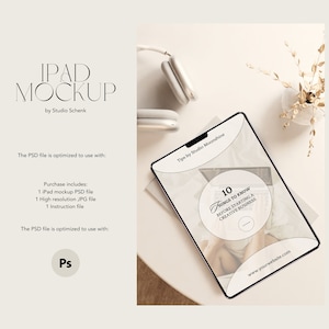 May include: A white iPad mockup with a black border, displaying a website with the text "10 Things to Know Before Starting a Creative Business". The iPad is on a white surface with a small vase of dried flowers and a pair of white headphones.