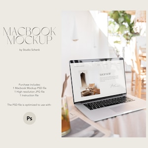 May include: A silver laptop computer with a white screen displaying a website with the text "SHOP NOW". The laptop is on a wooden table with a glass of iced tea in the foreground.