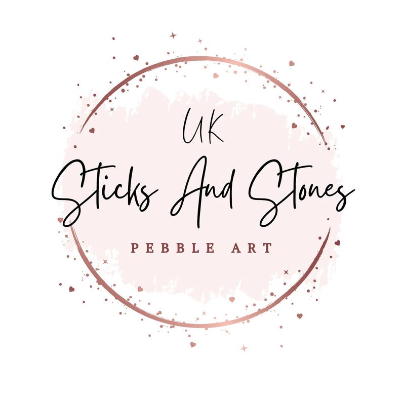 May include: A logo for "UK Sticks And Stones Pebble Art" features a pink watercolor-style circle with a rose gold outline and accents. The text is in a handwritten style, with "UK" at the top and "Pebble Art" at the bottom.