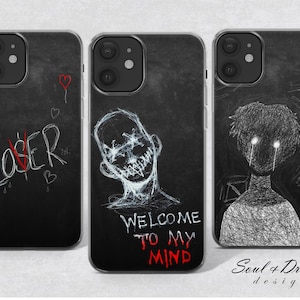 Pode incluir: Três capas de telefone pretas com designs gráficos em branco e vermelho. Uma capa diz "LOSER" com um "O" vermelho e um coração. Outra apresenta um rosto com boca costurada e o texto "WELCOME TO MY MIND". A terceira mostra uma figura com olhos brilhantes.