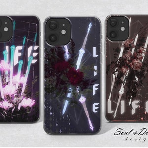 May include: Three phone cases with a dark background and a floral design. The cases feature the word "LIFE" in white text and a variety of abstract shapes and lines. The cases are designed by Soul + Dream.