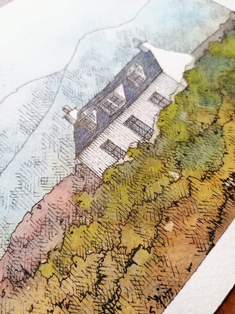 May include: A watercolor painting of a white house with a blue roof, surrounded by green bushes and trees. The house is set against a backdrop of a blue and white sky with mountains in the distance.