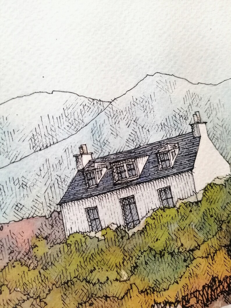 May include: A watercolor painting of a white cottage with a black roof and multiple windows. The cottage is nestled in a green hillside with a mountain range in the background.