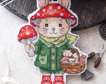 Forest forager cross stitch pattern PDF. Cute bunny in green coat with toadstool & basket with mushrooms. Instant download embroidery chart
