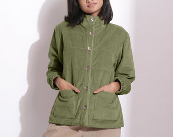May include: A green corduroy jacket with a button-up front and two pockets. The jacket has a stand-up collar and long sleeves.