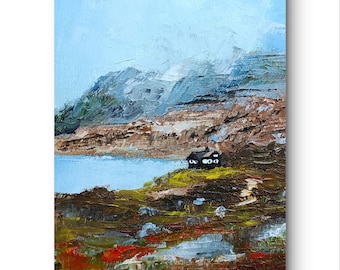 May include: An oil painting depicts a serene landscape with a small cabin nestled on a hillside. The artwork features a lake, mountains, and a sky with shades of blue. The color palette includes browns, greens, and reds, creating a textured, impressionistic style.