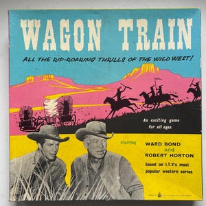 May include: A vintage "Wagon Train" board game box with a Wild West theme. The box art shows cowboys, covered wagons, and the words "WAGON TRAIN". It stars Ward Bond and Robert Horton, based on I.T.V's most popular western series.