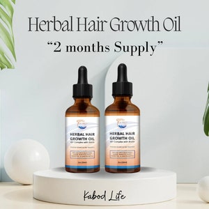 May include: Two amber glass bottles with dropper tops containing herbal hair growth oil. The bottles are labeled "Herbal Hair Growth Oil 40+ Complex with Biotin" and are sitting on a white platform. The text "Kabod Life" is printed below the bottles.