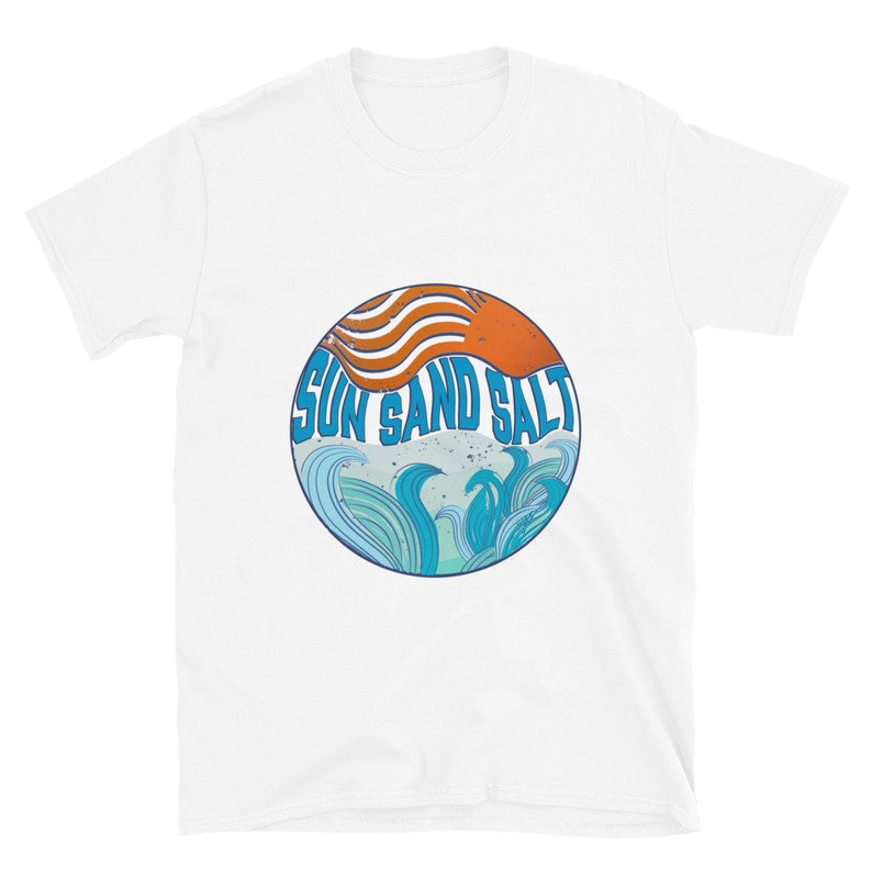 May include: White t-shirt with a circular graphic design featuring a stylized orange sun, blue waves, and the text "Sun Sand Salt".