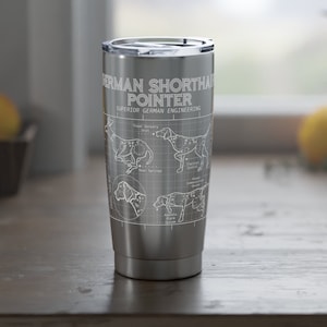 May include: A stainless steel travel mug with a white graphic of a German Shorthaired Pointer dog. The graphic includes the text "German Shorthaired Pointer" and "Superior German Engineering".