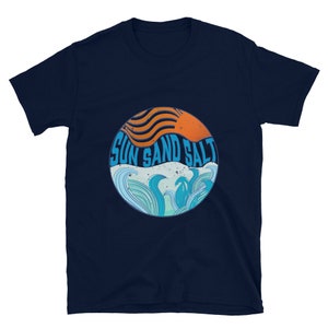 May include: Navy blue t-shirt with a graphic of a sun setting over waves and the text "Sun Sand Salt".