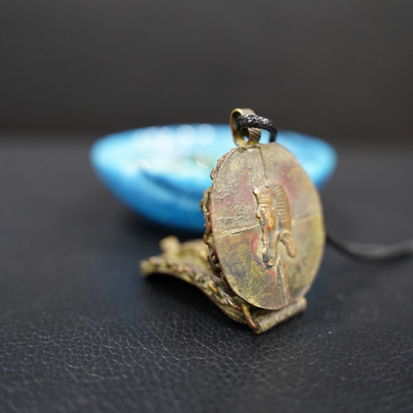 Divine Duo: Copper Amulet Honoring King Tutankhamun and Ptah, God of Creation and Craftsmanship