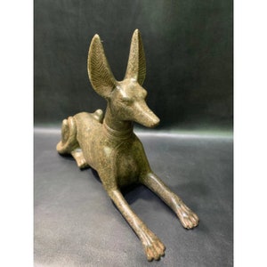 Anubis Jackal God of Afterlife & Mummification Seated To Protect The Dead Doctor Anubis jackal dog . image 1