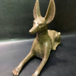 Anubis Jackal God of Afterlife & Mummification Seated To Protect The Dead Doctor Anubis jackal dog . image 3
