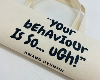 May include: A white canvas tote bag with black text that reads "Your behaviour is so... ugh!" and "HWANG HYUNJIN".