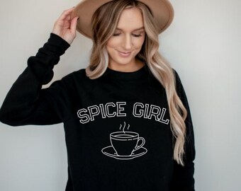 May include: Black sweatshirt with white text that reads "Spice Girl" and a graphic of a steaming cup of coffee.