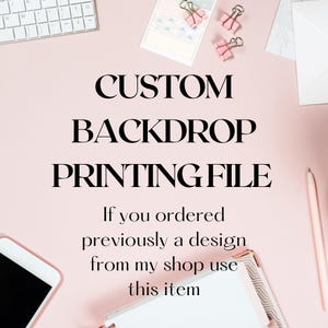May include: A light pink background with the text "CUSTOM BACKDROP PRINTING FILE". The image includes a white keyboard, a smartphone, pink paper clips, a pen, and a notebook.